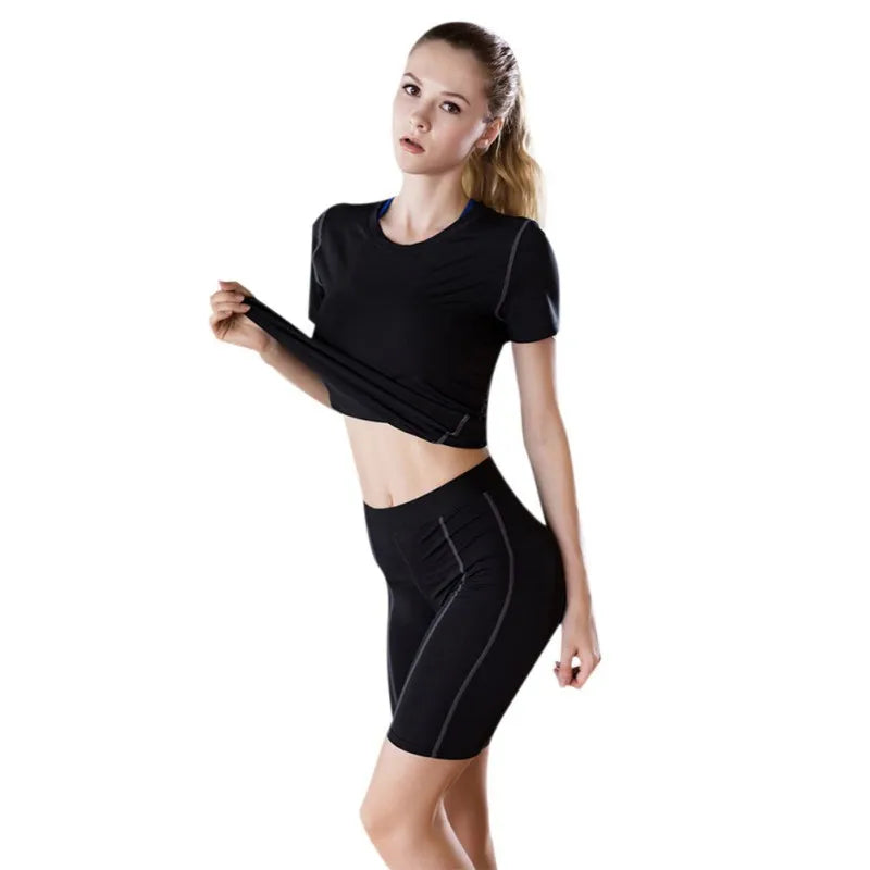 Model showcasing a Fitness Women's Quick Drying T-Shirt in black, perfect for high-performance workouts.