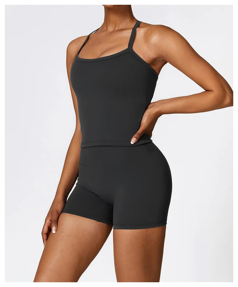 Model wearing a stylish black sports bra and shorts, showcasing comfort and activewear performance.