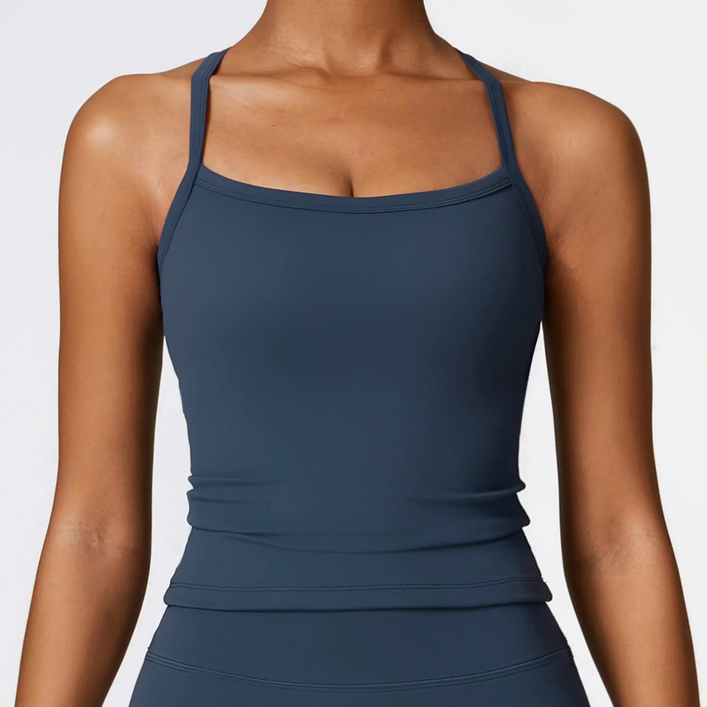 Cross back push-up sports bra in dark blue, featuring wide straps for shock-proof support and stylish performance.