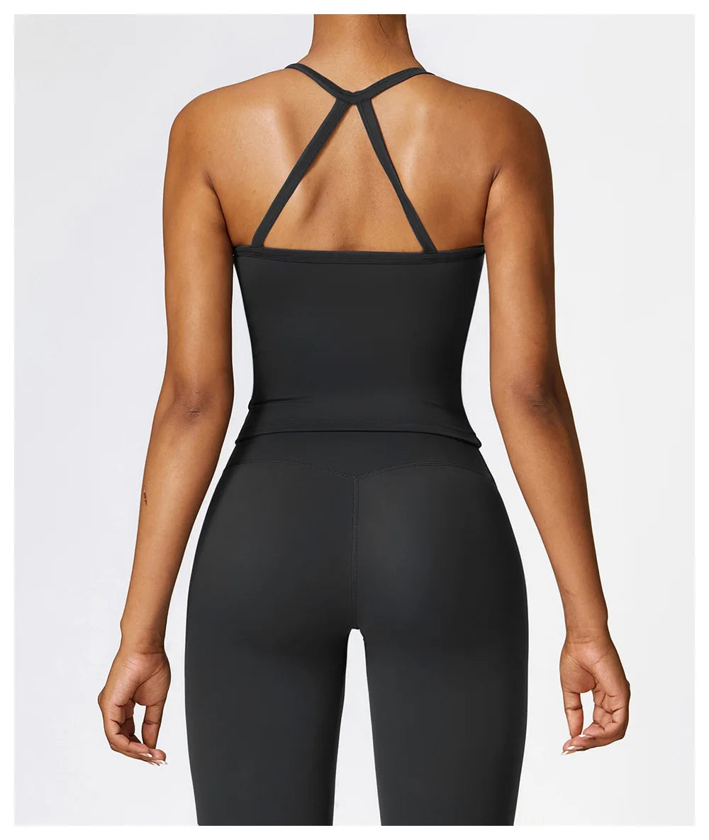 Back view of a woman wearing a black Cross Back Push-Up Sports Bra with wide straps and a fitted look.