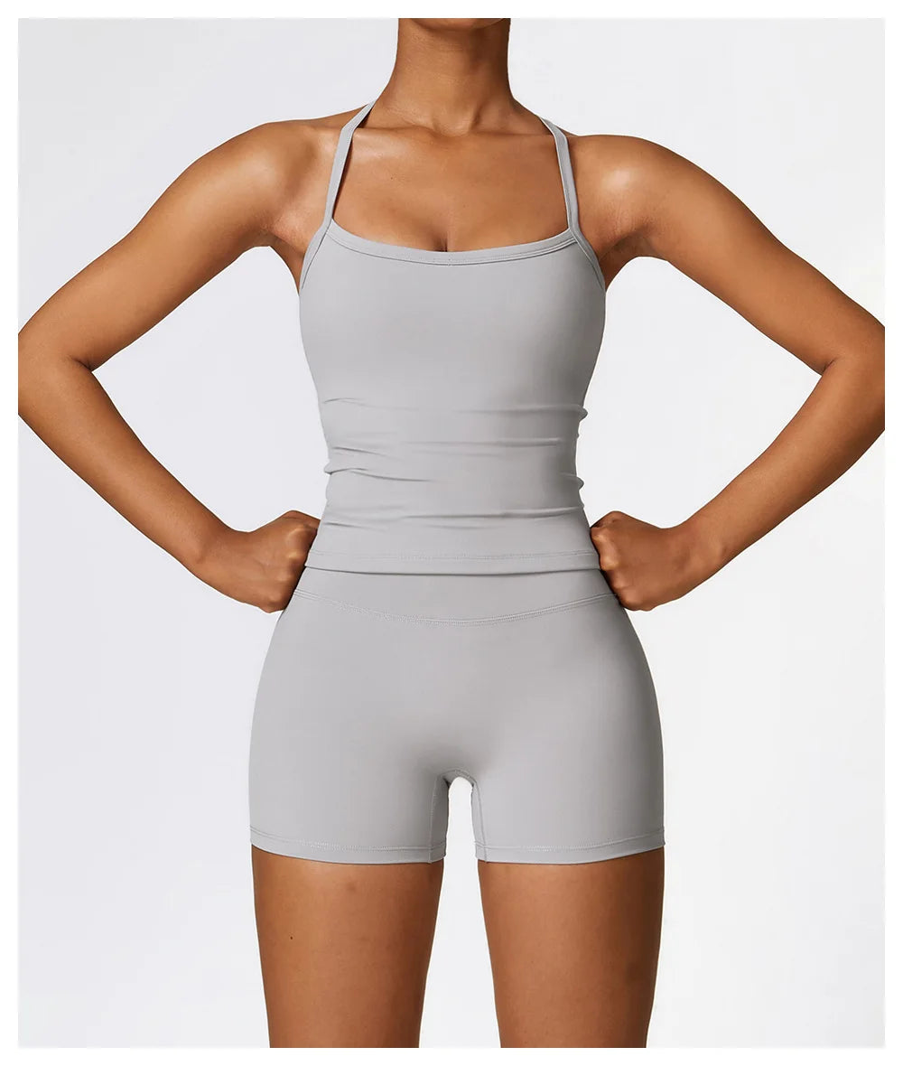 Model showcasing a smooth gray sports bra and shorts outfit, ideal for active lifestyles and workouts.