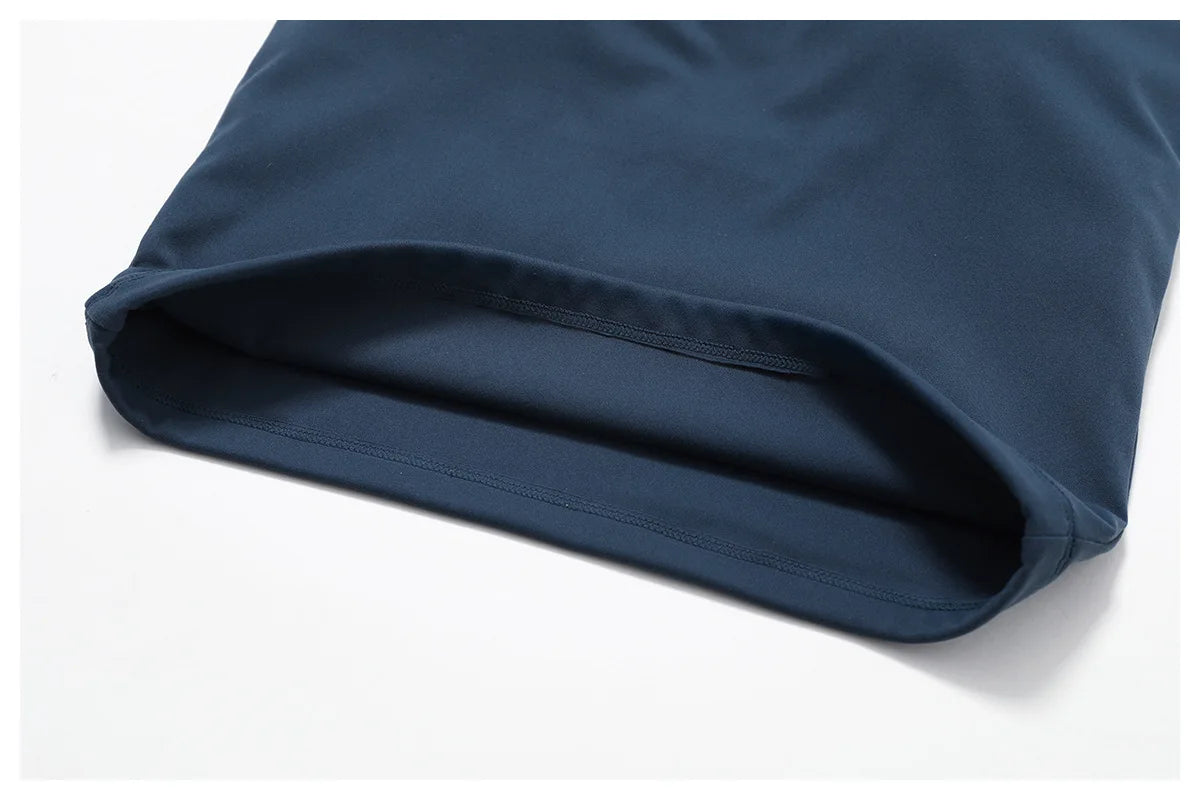 Close-up of a navy sports bra hem, showcasing its soft fabric and quality stitching for durability and comfort.