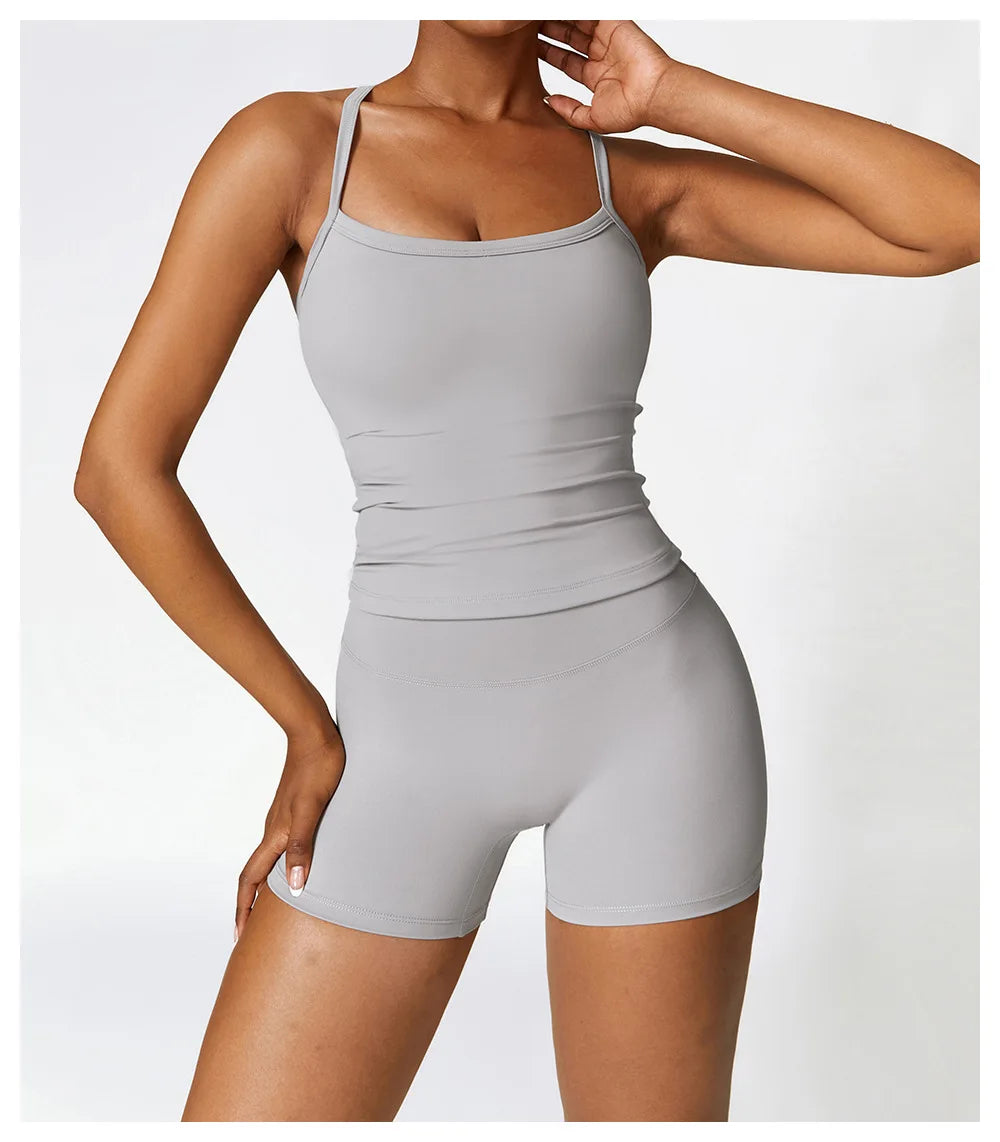 Grey women's activewear set featuring a form-fitting tank top and shorts for stylish, comfortable workouts.