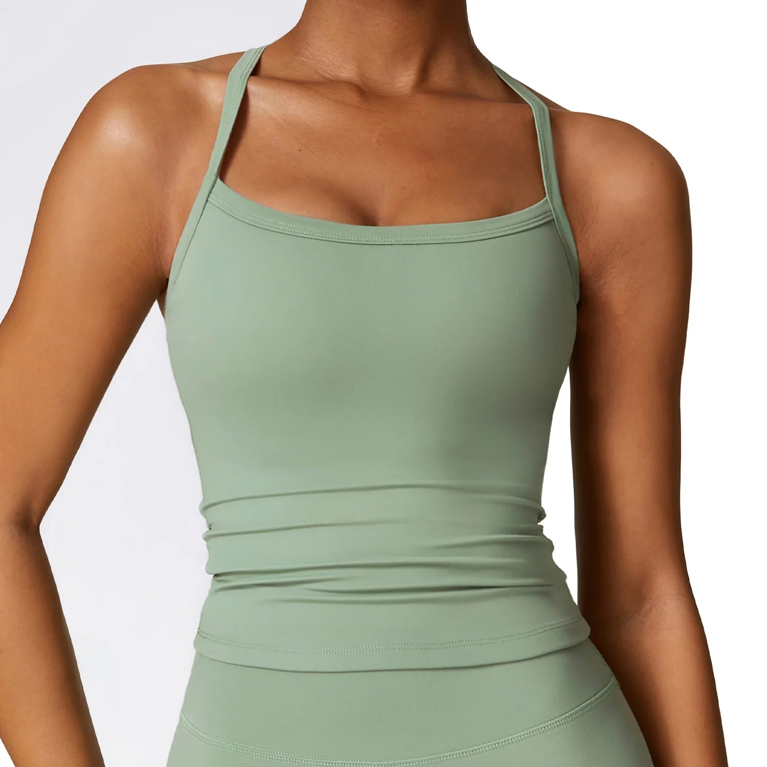 Cross back push-up sports bra in soft green, designed for high-impact support and stylish performance.