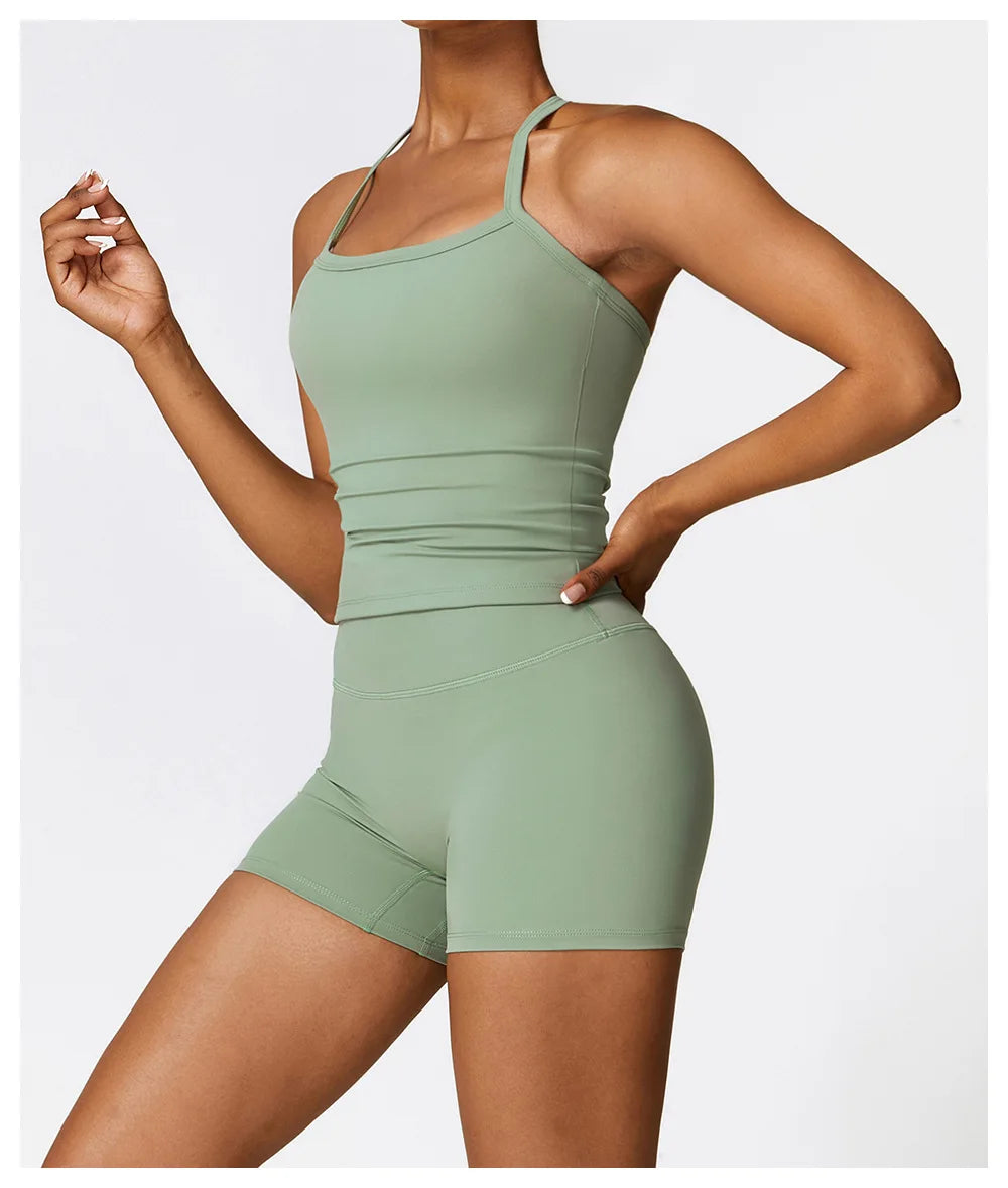 Woman in green sports bra and shorts, showcasing stylish activewear for comfort and performance.