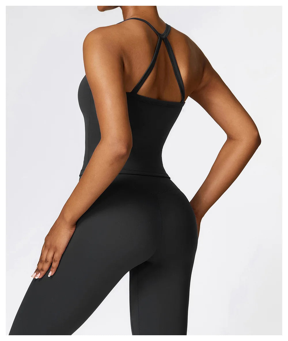 Model showcasing the Cross Back Push-Up Sports Bra with wide straps and a stylish design from the back.