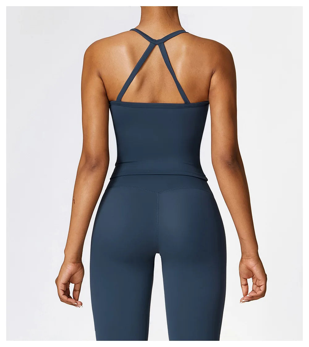 Back view of a woman in a Cross Back Push-Up Sports Bra, showcasing its wide straps and stylish design for support.